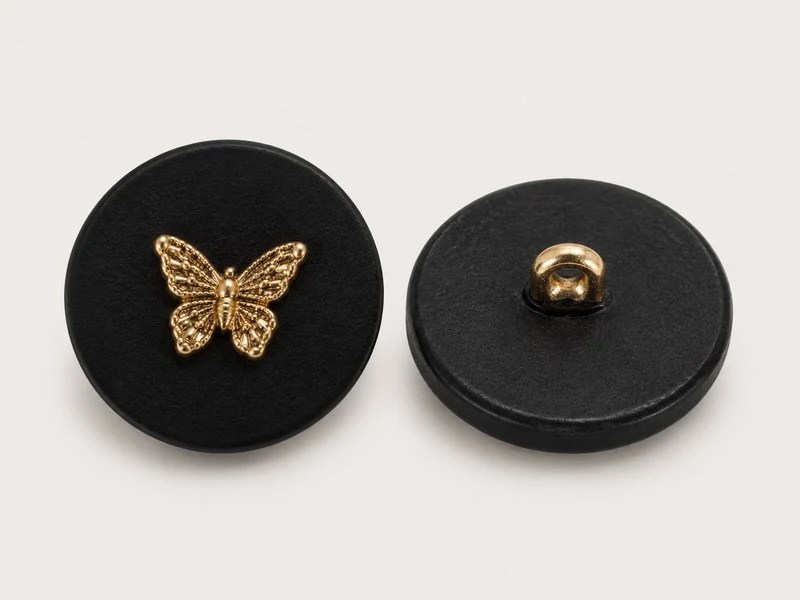 KN2407002 black horn and alloy button with gold-tone butterfly decoration, front and reverse.
