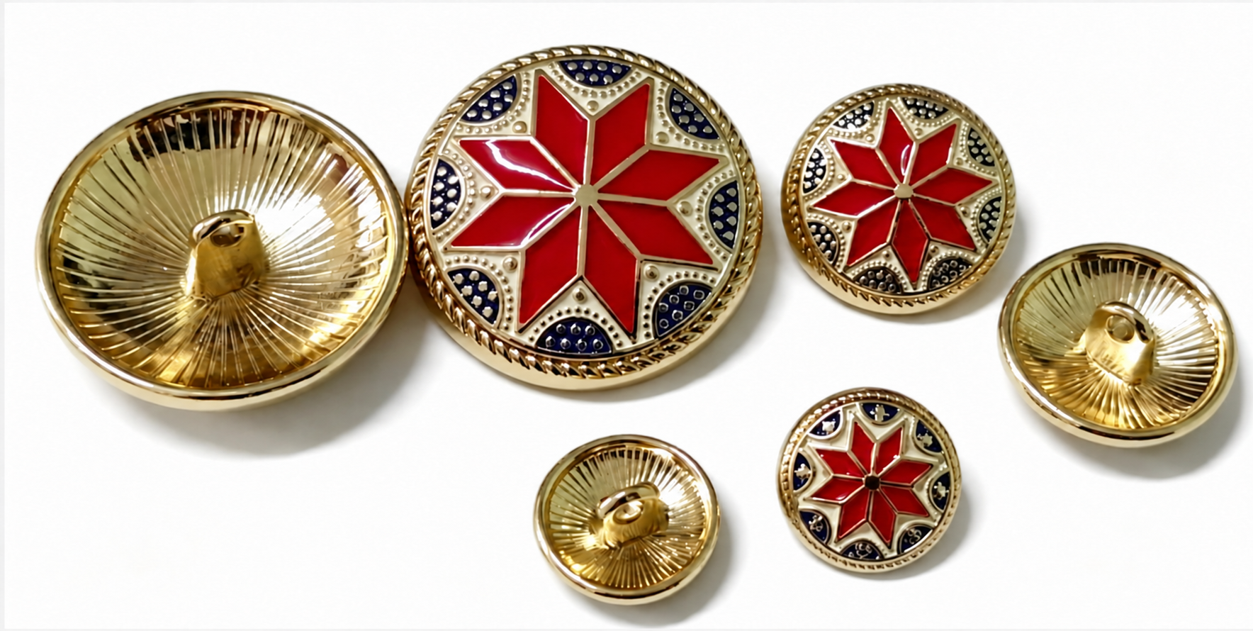 First hand-applied color-filling samples of star-pattern alloy buttons in three sizes, shown from the front and reverse